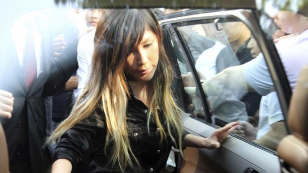 Singaporean pop music singer Ho Yeow Sun, popularly known as Sun Ho, gets in a car as she leaves the Subordinate Courts in Singapore in file photo from June 2012.