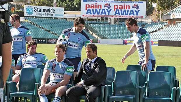 Sitting start ... the Blues assemble at Parramatta Stadium yesterday for the official team photo. Kurt Gidley, centre, is with Andrew Johns.