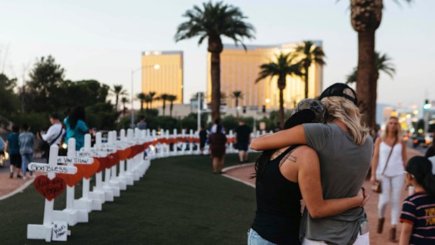 A memorial displaying 58 crosses stands at the "Welcome To Las Vegas Sign" in Las Vegas. Each cross has the name of a victim killed during the October mass shooting.