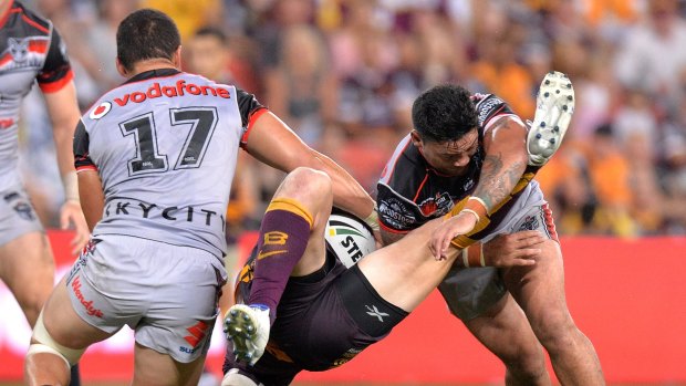 Stopped in his tracks: Josh McGuire is upended by Issac Luke.
