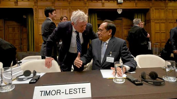 East Timor's Foreign Affairs minister Jose Luis Gutierrez (right) speaks with Australian lawyer Bernard Collaery in The Hague.