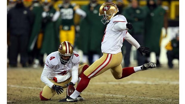 Phil Dawson of the San Francisco 49ers kicks a field goal to defeat the Green Bay Packers.