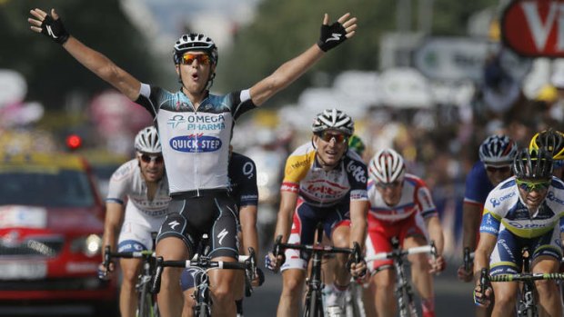 Edged out: Matteo Trentin of Italy beats Michael Albasini of Switzerland, far right, to win stage 14 of the Tour de France.
