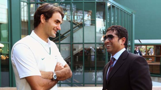Lofty company ... Roger Federer meets cricketer Sachin Tendulkar at the All England Club on Saturday.
