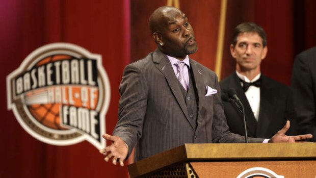 Honoured: Inductee Gary Payton speaks during the enshrinement ceremony for the 2013 class of the Naismith Memorial Basketball Hall of Fame as Hall-of-Famer John Stockton,  looks on at Symphony Hall in Springfield, Massachusetts.