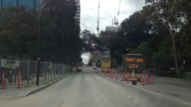Pictures reveal trucks entering and exiting the Elizabeth Quay development site, which contains contaminated soils,  are depositing dirt and mud onto busy Perth streets.