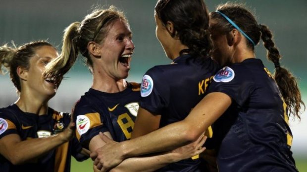 Elise Kellond-Knight (second left) of Australia celebrates with her teammates after she scored the winning goal.