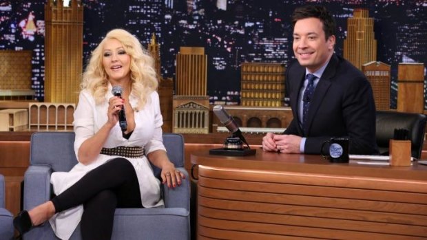 Christina Aguilera and host Jimmy Fallon play Wheels of Impressions.