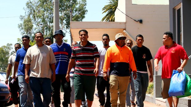Alf Fangaloka (orange shirt) leads the Tongan arrivals down Robinvale's main street this week.