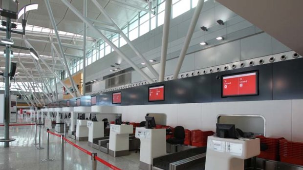 Deserted ... the domestic departures terminal at Sydney Airport yesterday.