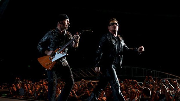 The Edge and Bono strut their stuff at U2's first concert last night in Sydney.