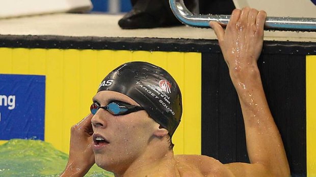 Beat that: Thomas Fraser-Holmes checks his winning time after the 200 metres freestyle final.