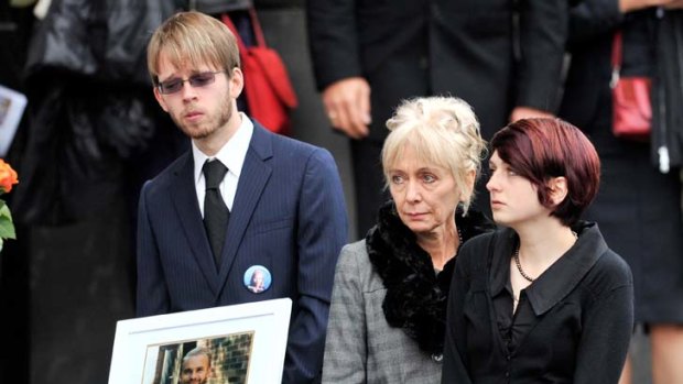 In tears ... Max, Linda Wostry and Camille at Greg Ham's funeral service yesterday.