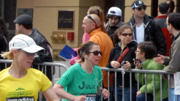 Chilling: A photograph, taken by a spectator 10 to 20 minutes before the Boston Marathon blasts, shows Dzhokhar and  Tamerlan Tsarnaev in the crowd near the finish line.