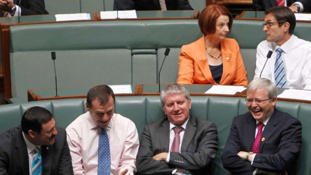 Foreign minister Kevin Rudd talks with MPs Mike Kelly, Graham Perrett and Brendan O'Connor as Prime Minister Julia Gillard speaks with climate change minister Greg Combet in parliament last Wednesday.