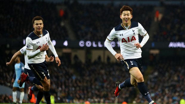 Share of the spoils: Heung-Min Son scored Spurs' second against Manchester City.