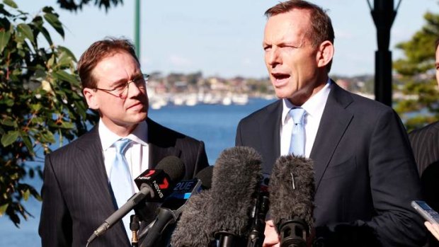 Opposition leader Tony Abbott in Sydney earlier this month with Coalition environment spokesman Greg Hunt. The Coalition has attacked the government's move to an emissions trading scheme earlier than planned.