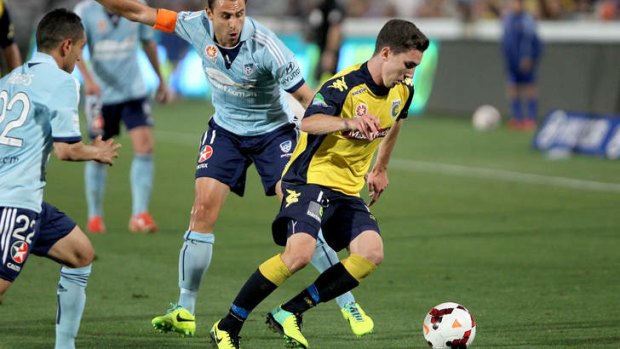 Storm Roux of the Mariners turns away from Richard Garcia of Sydney FC.