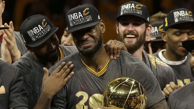 Emotional: LeBron James tears up as the Cavaliers receive the Larry O'Brien trophy after NBA Finals 2016. 