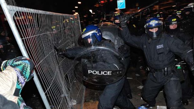British riot police clash with protesters