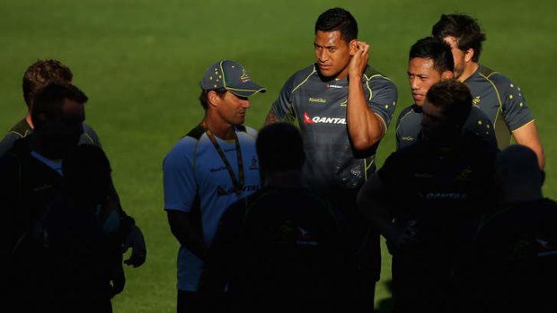All ears: Israel Folau listens as coach Robbie Deans gives the orders at Wallabies training this week.