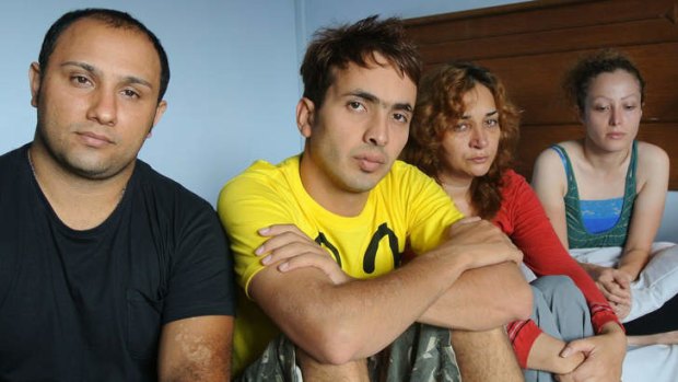 Stranded at sea : Asylum seekers Farhad, Benyamin, Maryam and Narges in Indonesia after their rescue.