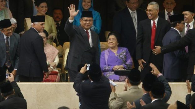 Mr Joko's rival for the presidency, Prabowo Subianto, attended the  ceremony.