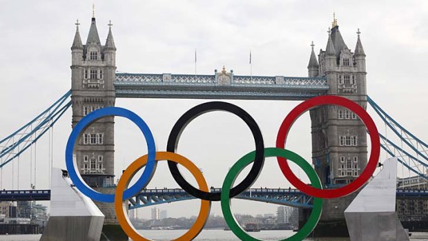 Olympic rings, mounted on a barge, are positioned in front of Tower Bridge on the River Thames in London February 28, 2012.  REUTERS/Andrew Winning    (BRITAIN - Tags: ENTERTAINMENT CITYSPACE SOCIETY SPORT OLYMPICS)