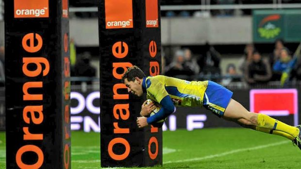 Clermont's fullback Jean Marcellin Butin dives under the post.