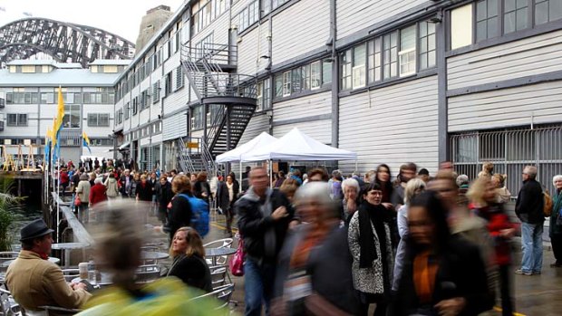 The rain did nothing to deter people from queueing at the Sydney Writers' Festival in Walsh Bay on Thursday.