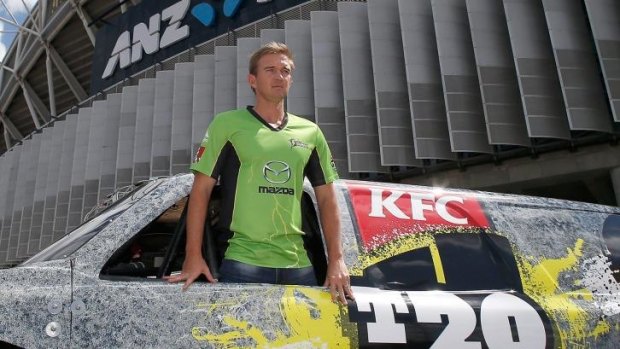 Australian Test cricketer Nathan Hauritz poses with a T20 Big Bash League Monster Truck at ANZ Stadium.