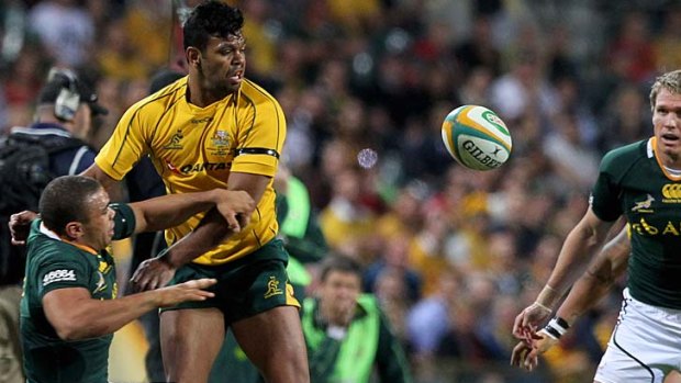 Kurtley Beale tackles South African winger Bryan Habana during the Rugby Championship Test in Perth.
