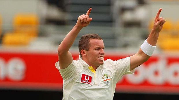 Got him: Paceman Peter Siddle celebrates a wicket yesterday.