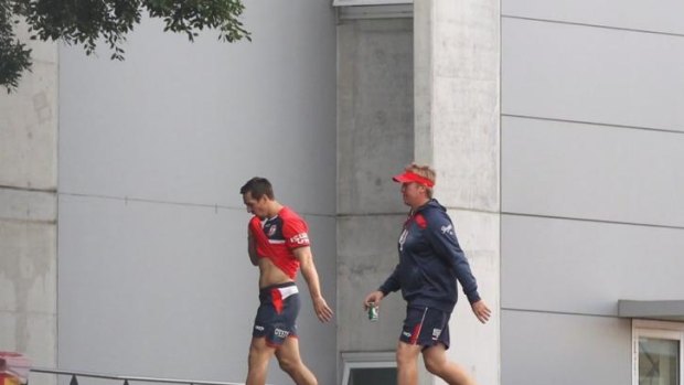Back to work: Mitchell Pearce and Trent Robinson leave training on Monday.