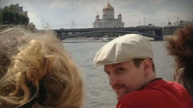 Closely protected: A man said to be US fugitive Edward Snowden is photographed cruising the Moscow River in a picture published on a Russian website.