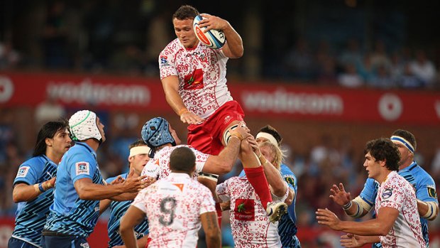 Jake Schatz climbs high for the Queensland Red in their match with the Bulls at Loftus Versfeld in Pretoria.