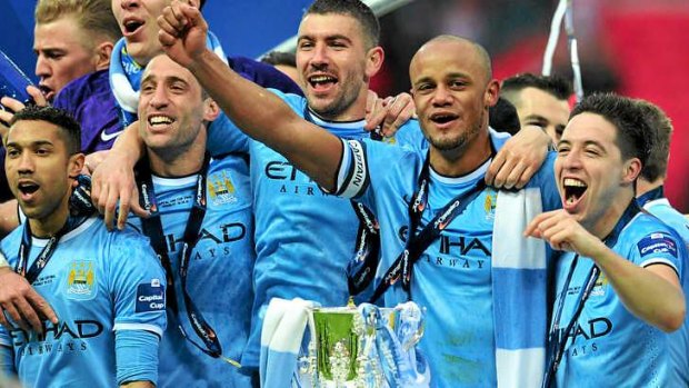 Manchester City celebrate with the League Cup.