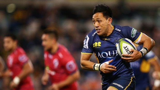 Front-runners: Christian Lealiifano finds space against the hapless Reds.