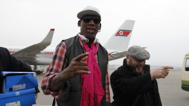 Former NBA basketball star Dennis Rodman and his entourage arrive at the international airport in Pyongyang, North Korea.