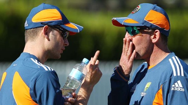 Out in the open ... captain Michael Clarke and coach Tim Nielsen put their heads together at training in Brisbane this week.