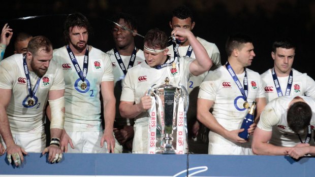 Hollow: England struggle to celebrate their Six Nations victory.