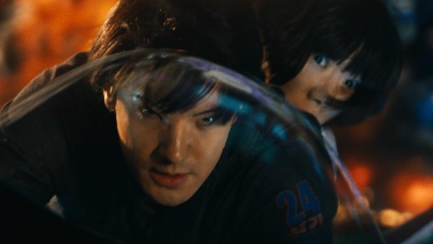 Jim Sturgess (left) with South Korean actress Doona Bae in another futuristic scene.