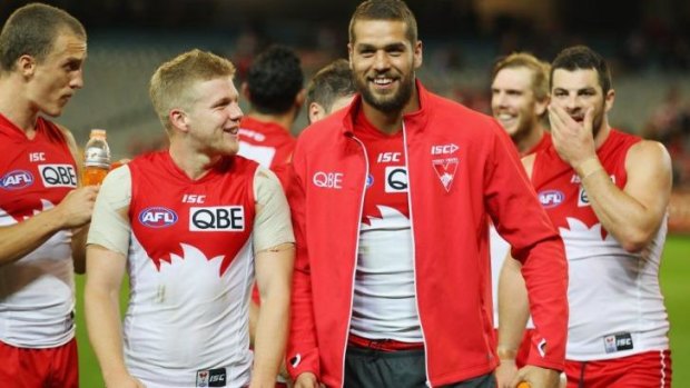 Lance Franklin leaves the field with Daniel Hannebery after the game.