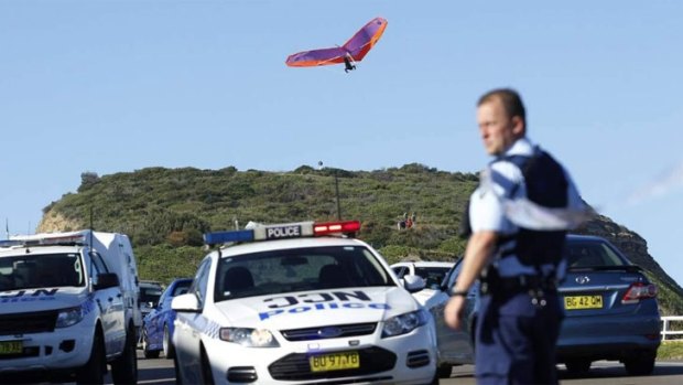 Other thrillseekers continue to hang-glide near the scene of a fatal crash in Newcastle on Sunday. 