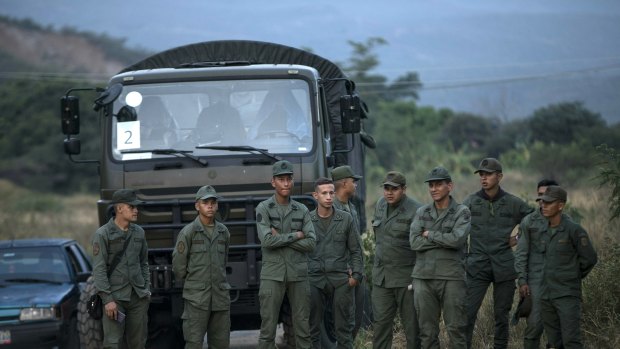 Soldiers stand at the entrance of the Tienditas International bridge that connects Venezuela with Colombia on Thursday.
