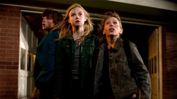 Working the mystery: Alice (Elle Fanning, centre), Joe (Joel Courtney, left) and Cary (Ryan Lee) confront the many riddles in the JJ Abrams film Super 8.