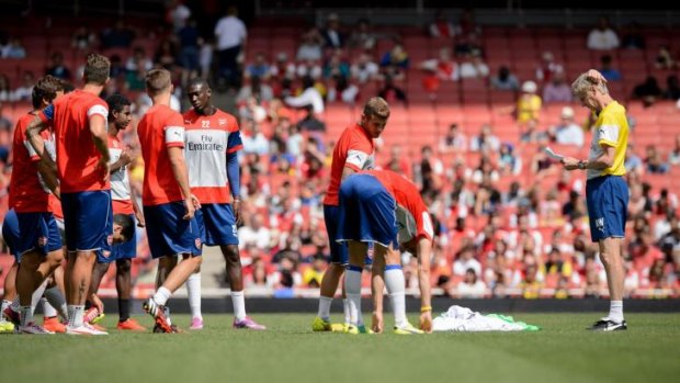 Arsene Wenger (extreme right) during Arsenal's first team training session on Thursday.