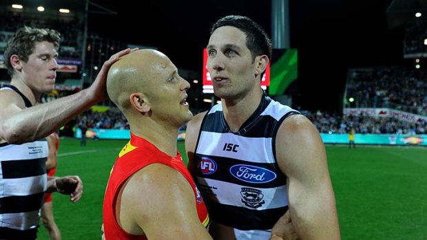 Geelong's Harry Taylor greets Gary Ablett after the game.