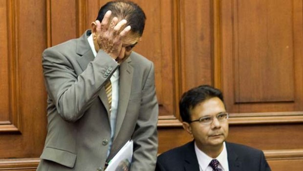 Grieving ... Vinod Hindocha, father of Anni Dewani, rubs his eye in a previous court.