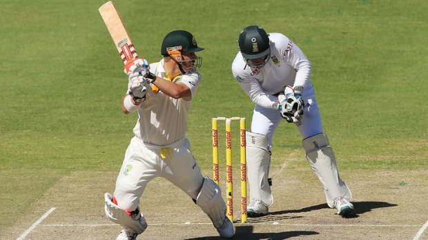 David Warner cuts backward of point during the deciding Test at Cape Town.
